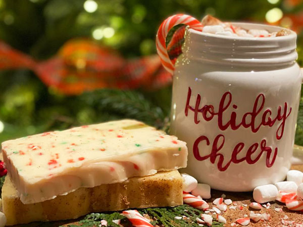 Candy Cane Fudge with a mug of hot chocolate beside with the words Holiday Cheer!