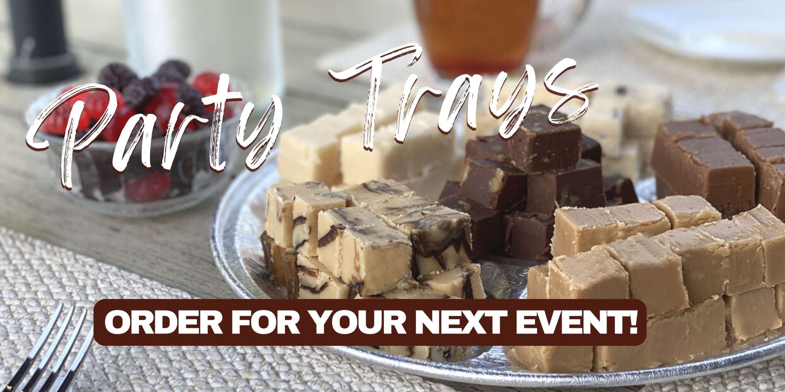 Photo of a fudge party tray and bowl of candies beside it