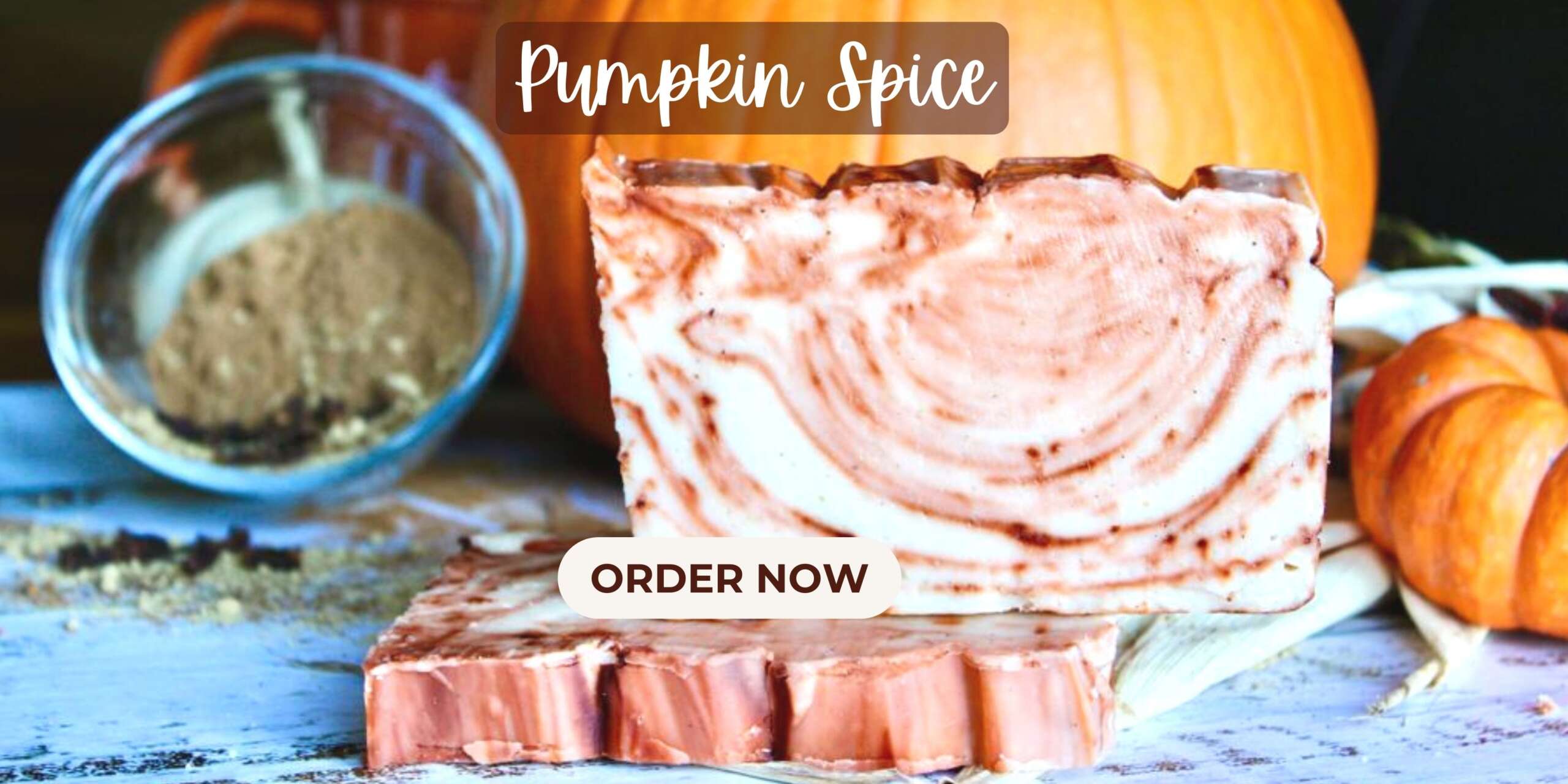 Pumpkin Spice Fudge with pumpkins and spices in the background