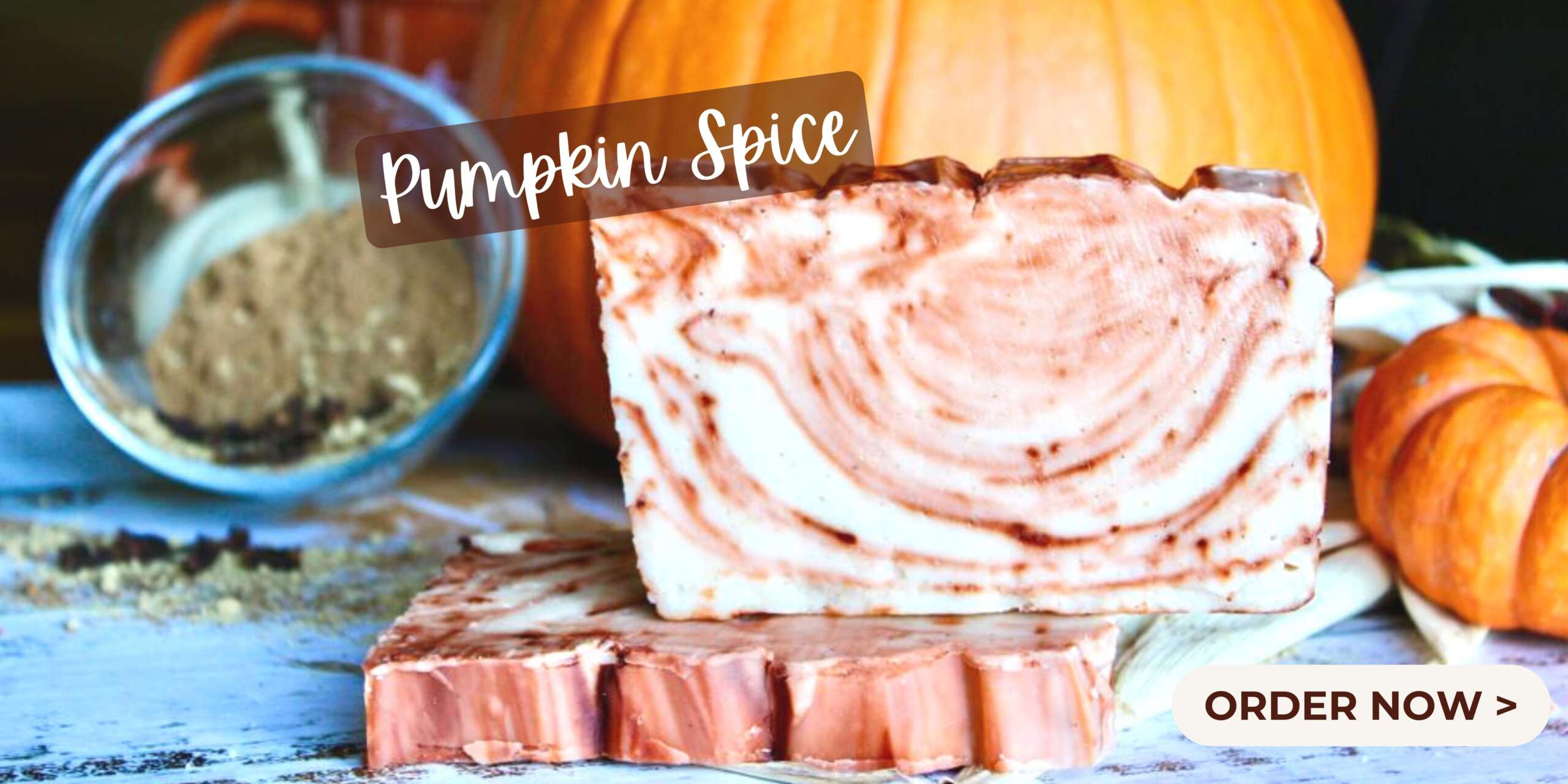 Pumpkin Spice Fudge with pumpkins and spices in the background